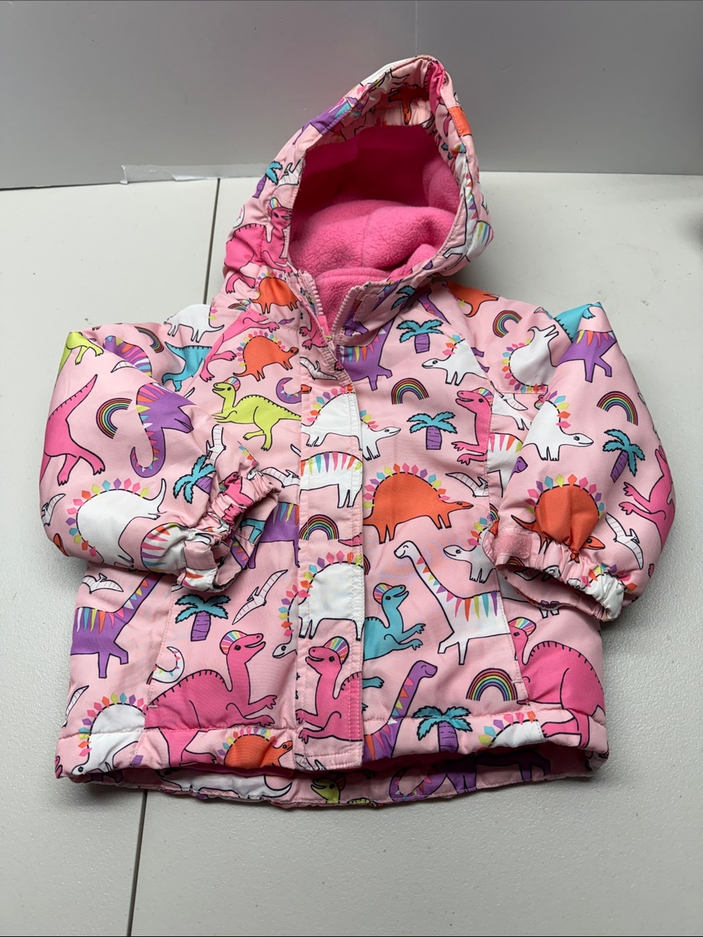 The Children's Place Pink Hooded Puffer Jacket with Colorful Dino Print. Size 3T